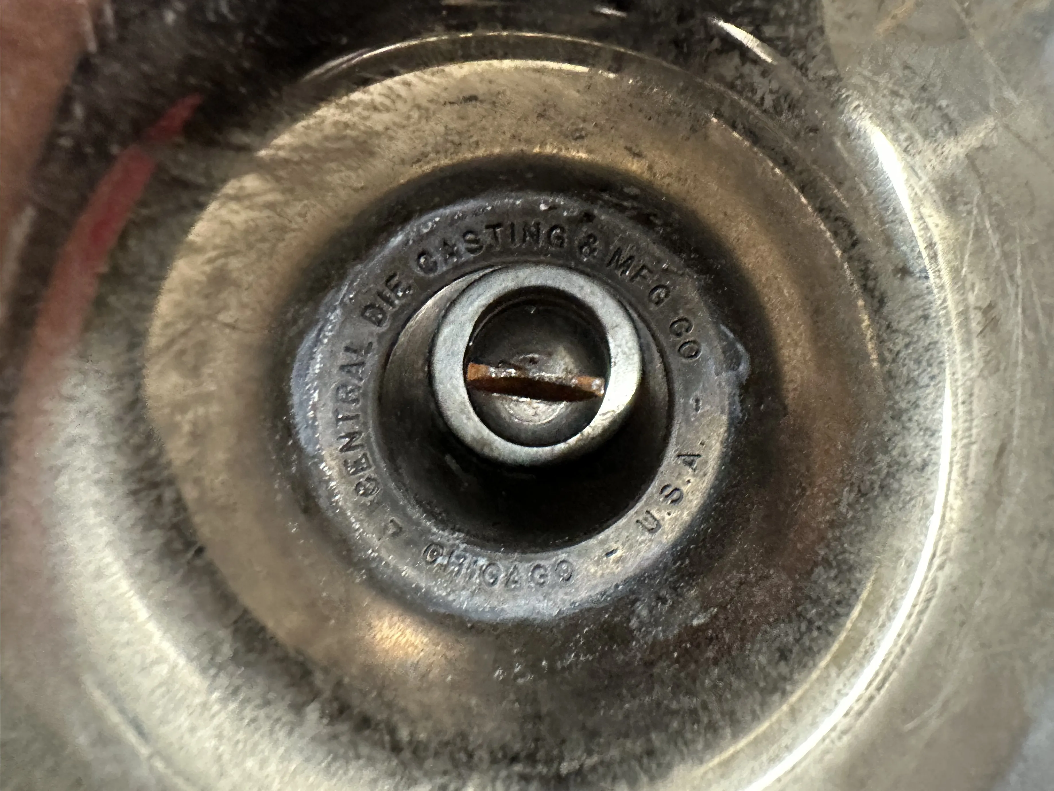 circular seal featuring Central Die Casting & Mfg Co. and a bulldog detail, perfect for antique collectors.