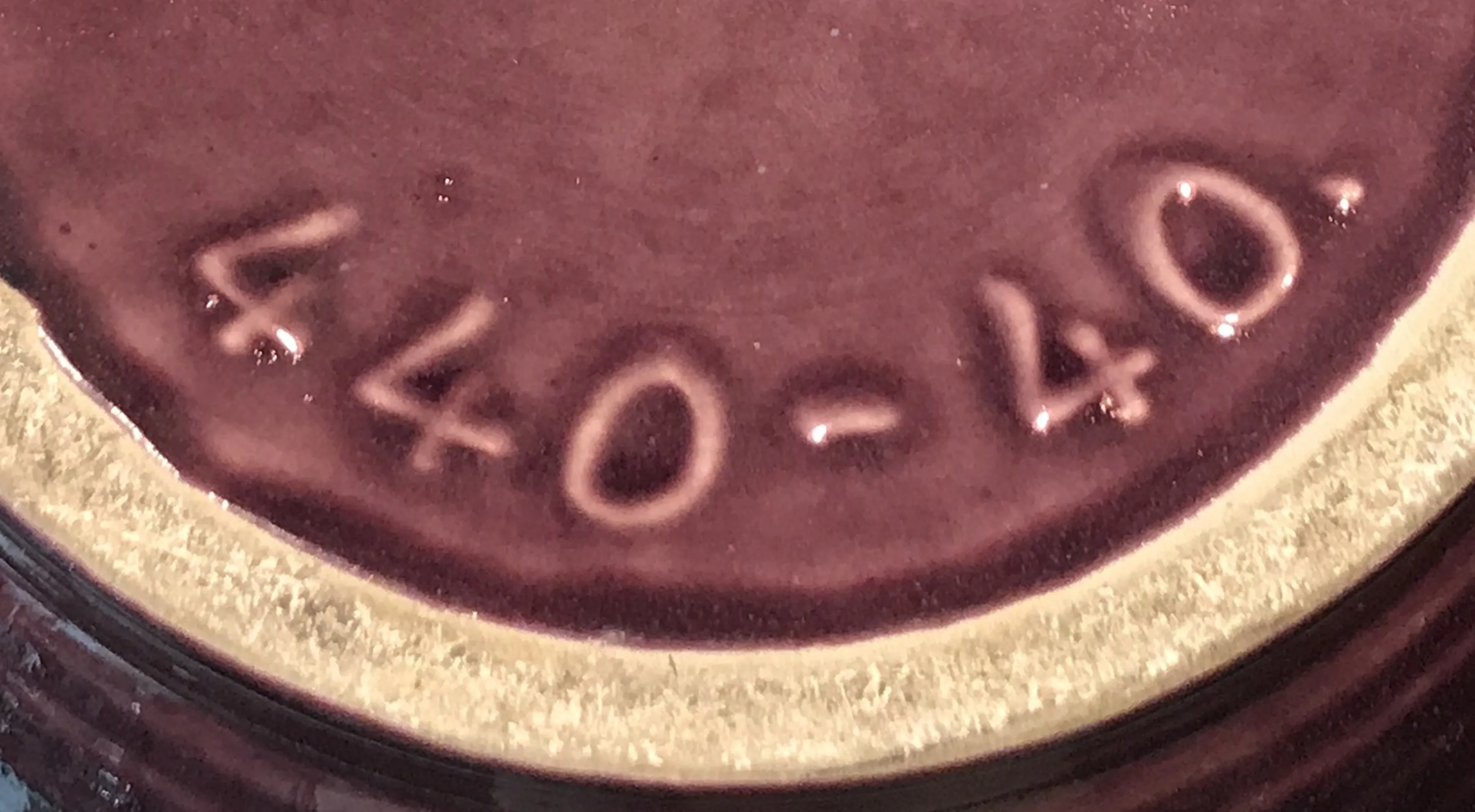 Antique seal with the inscription 440-40 visible.