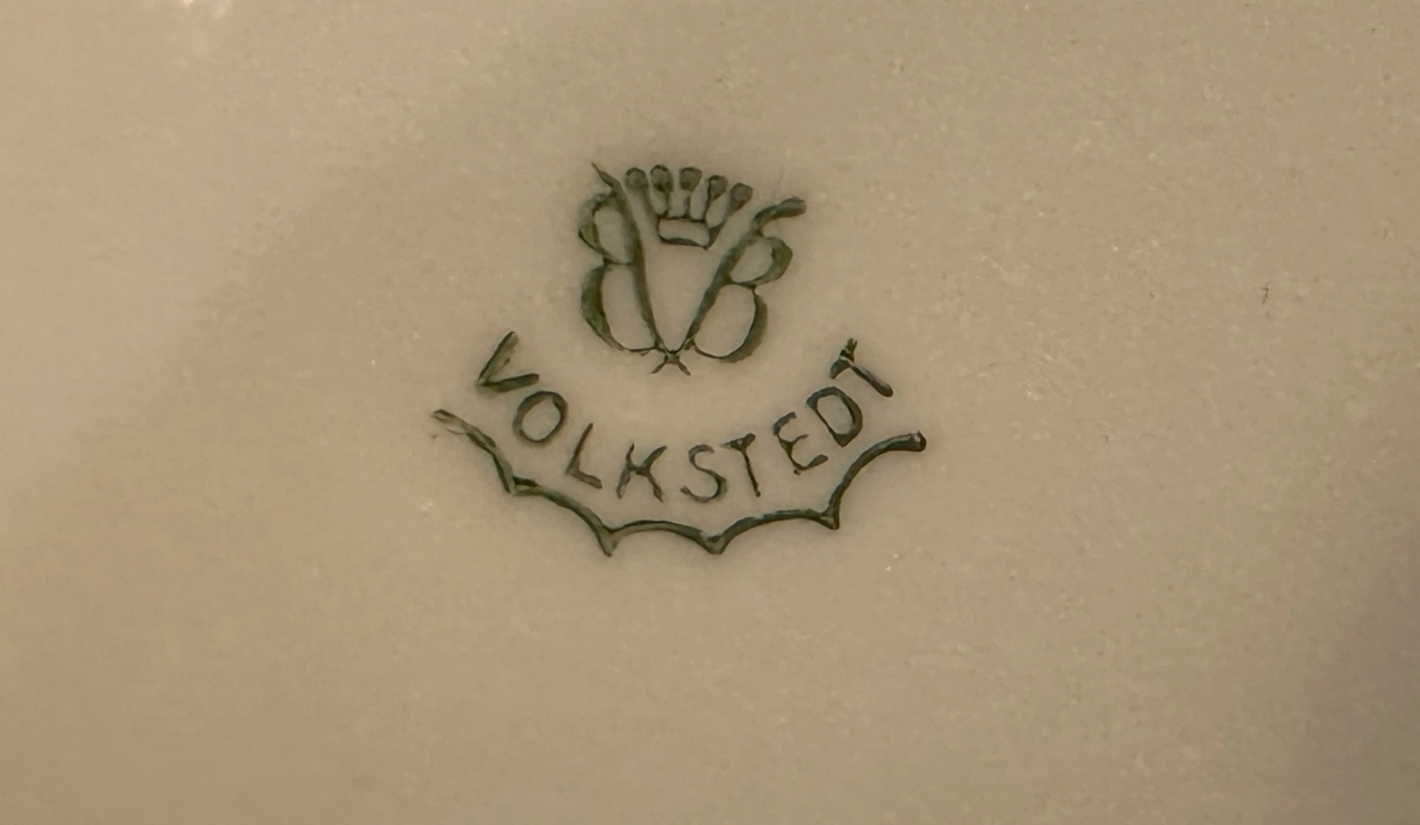 Antique Volkstedt seal with unique design.