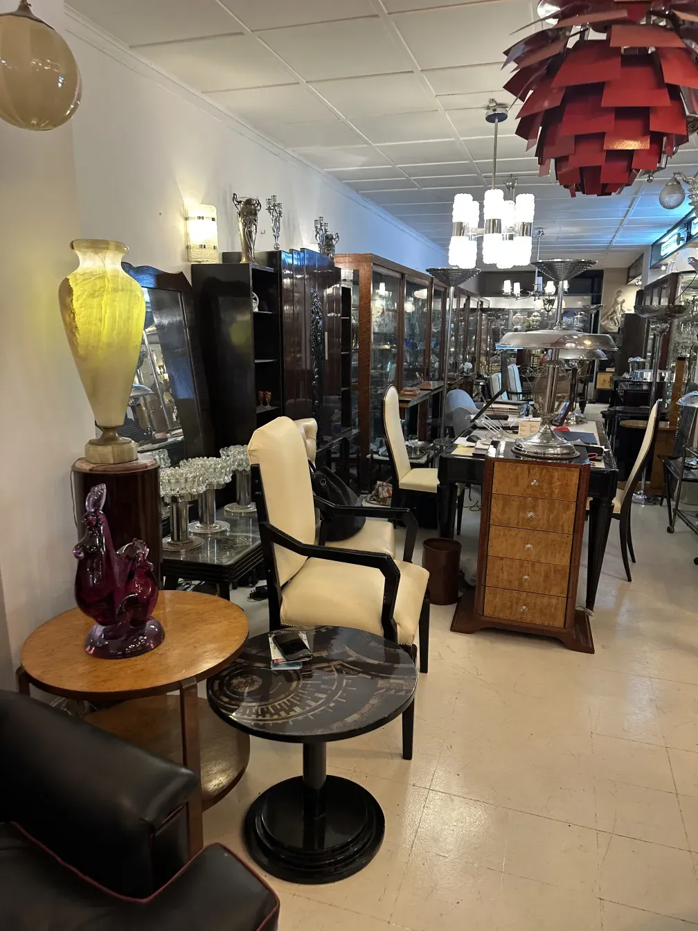 Antique cabinet in an antique setting with various furniture