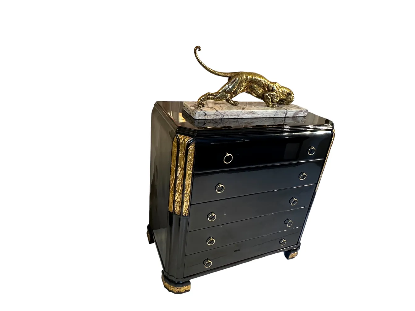 Antique black cabinet with golden details and a decorative top.
