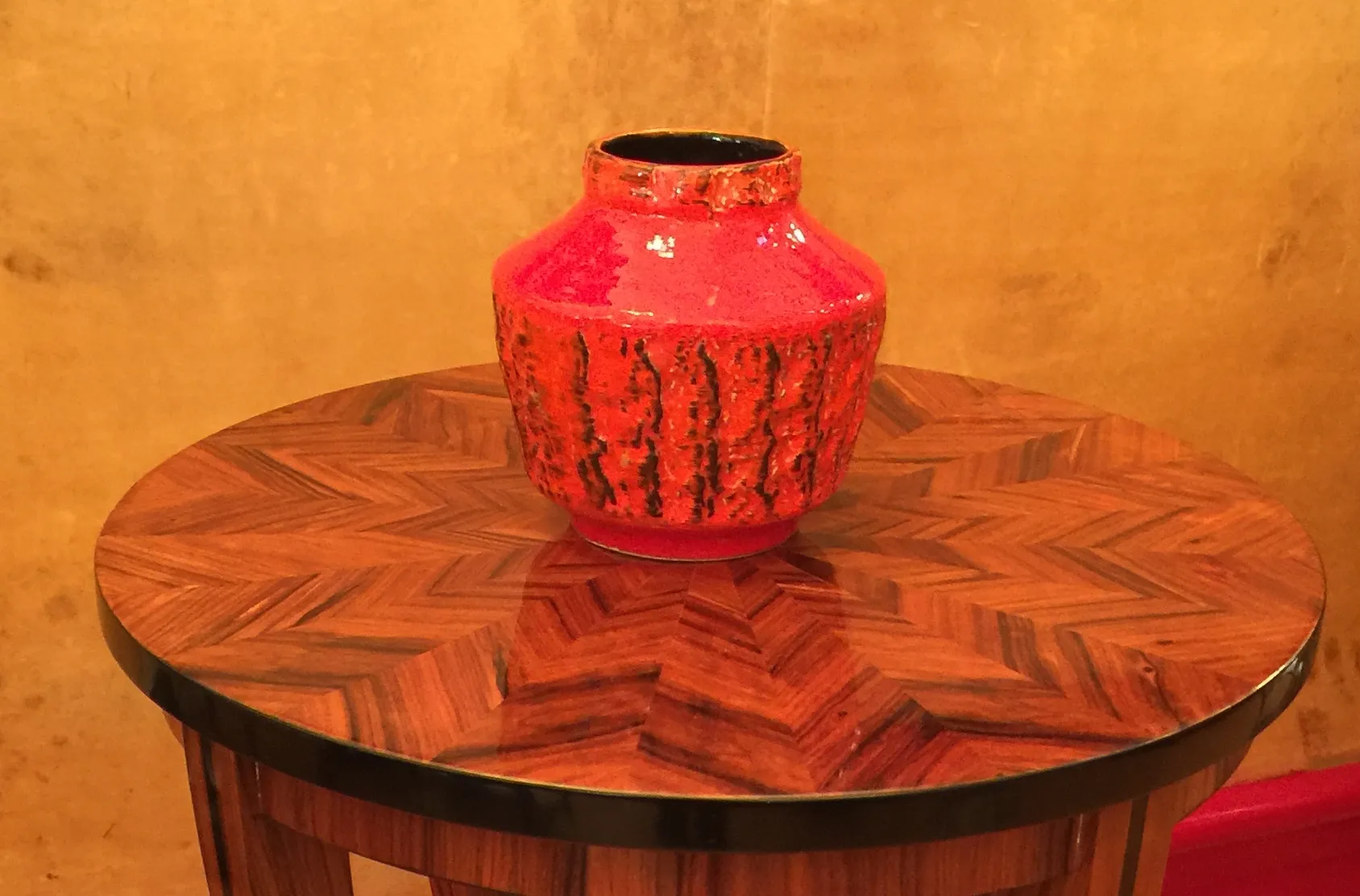 Colorful antique ceramic on patterned wooden table