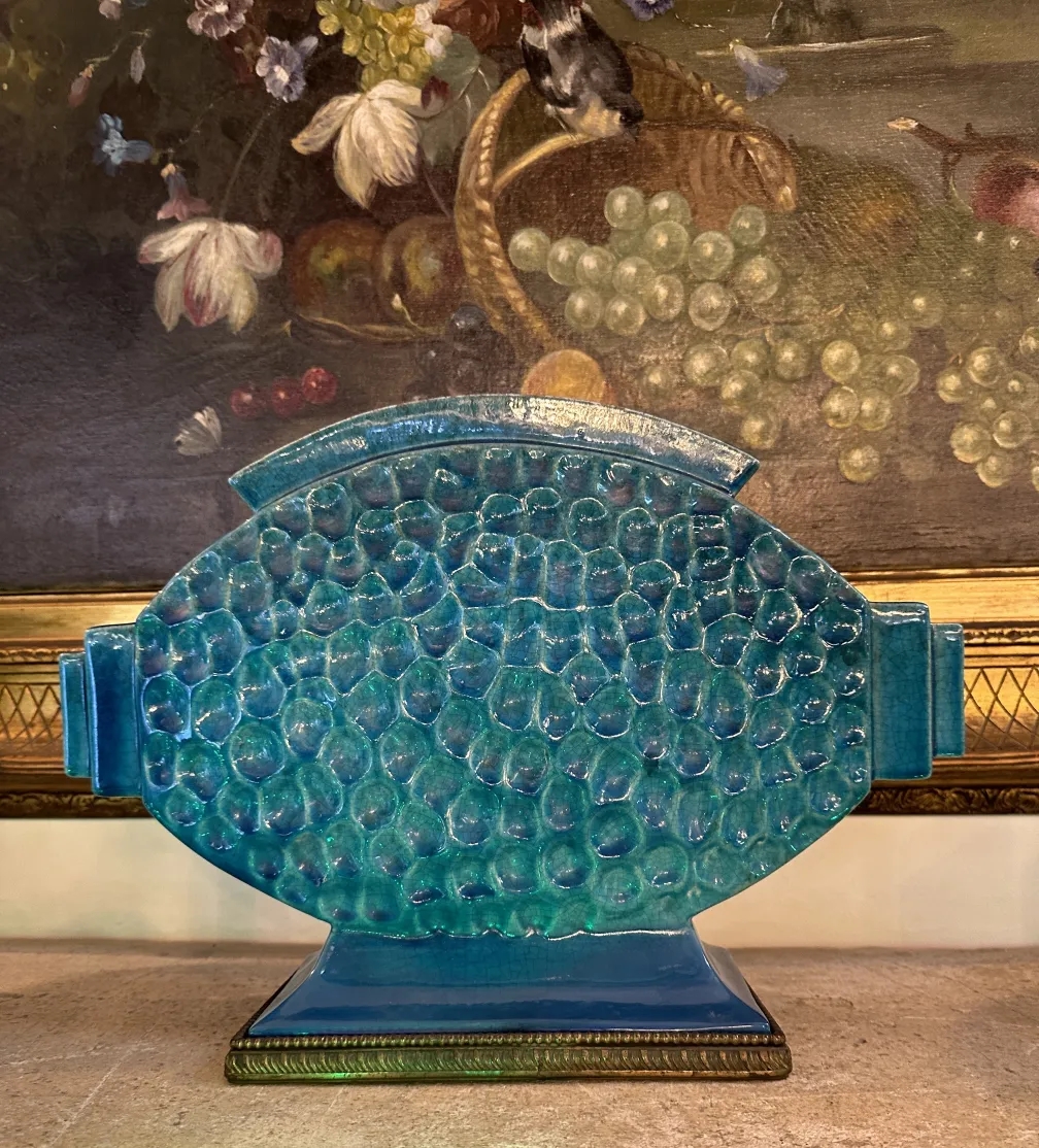 Antique blue decorative ceramic with unique texture in a classic setting.