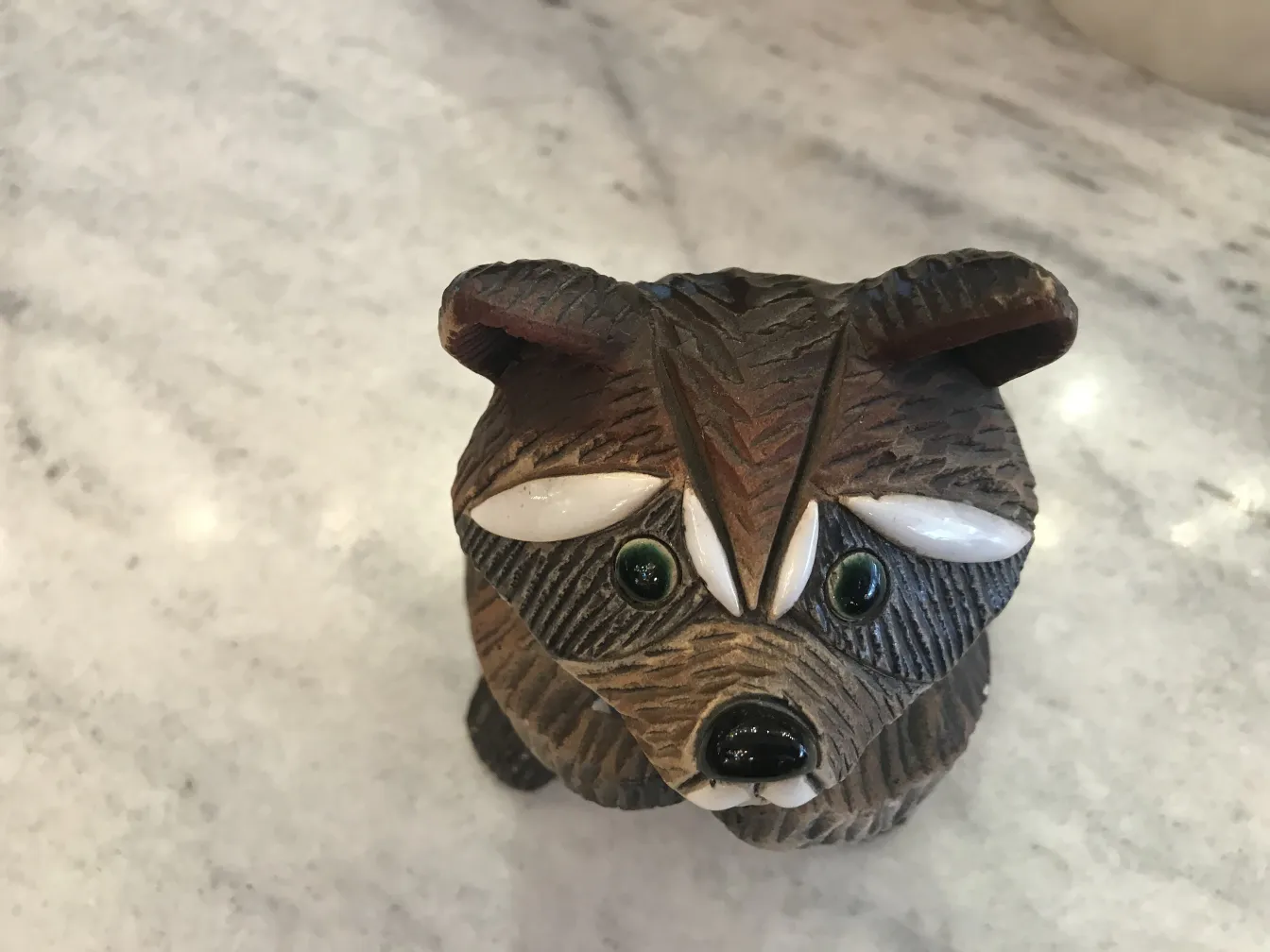 antique ceramic figure of an animal with wood details