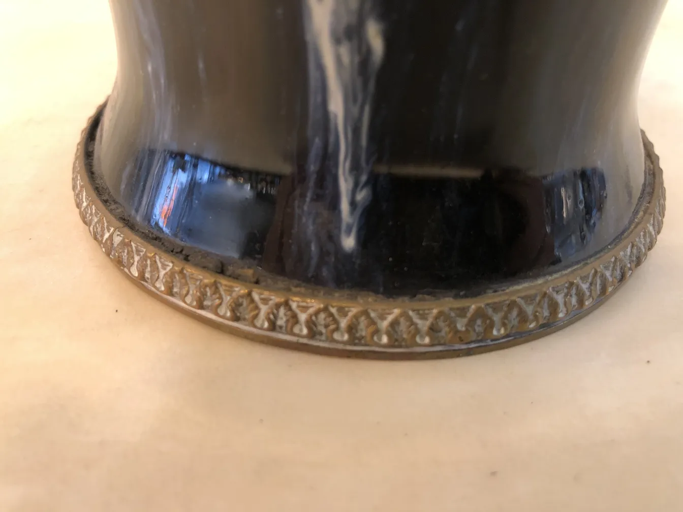 Antique ceramic piece with a decorative golden base.