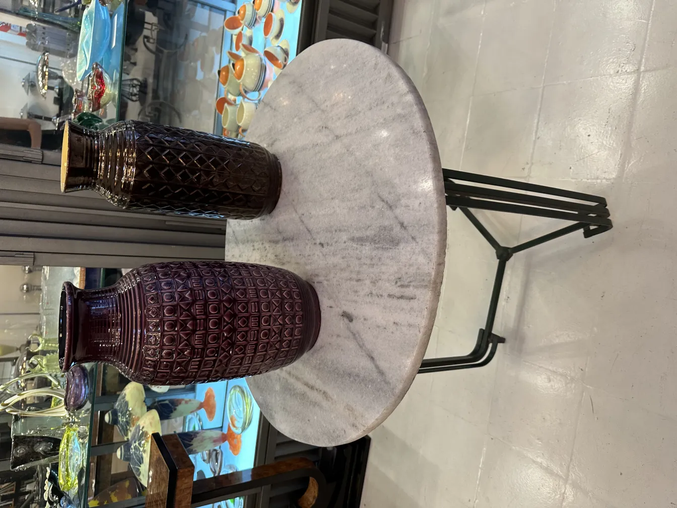 Purple antique ceramic vases on a marble table