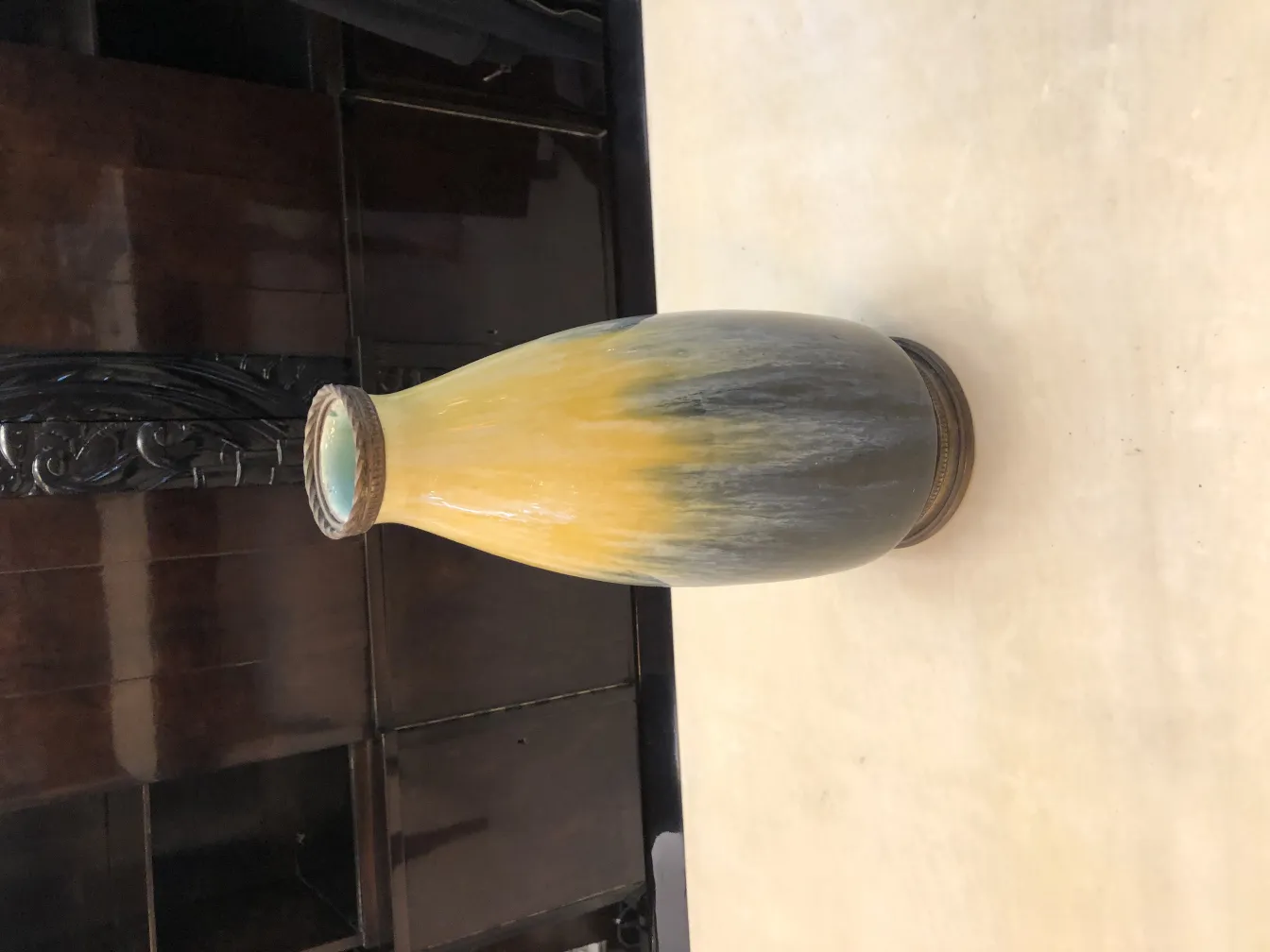 Antique ceramic vase with gray and yellow hues, decorative