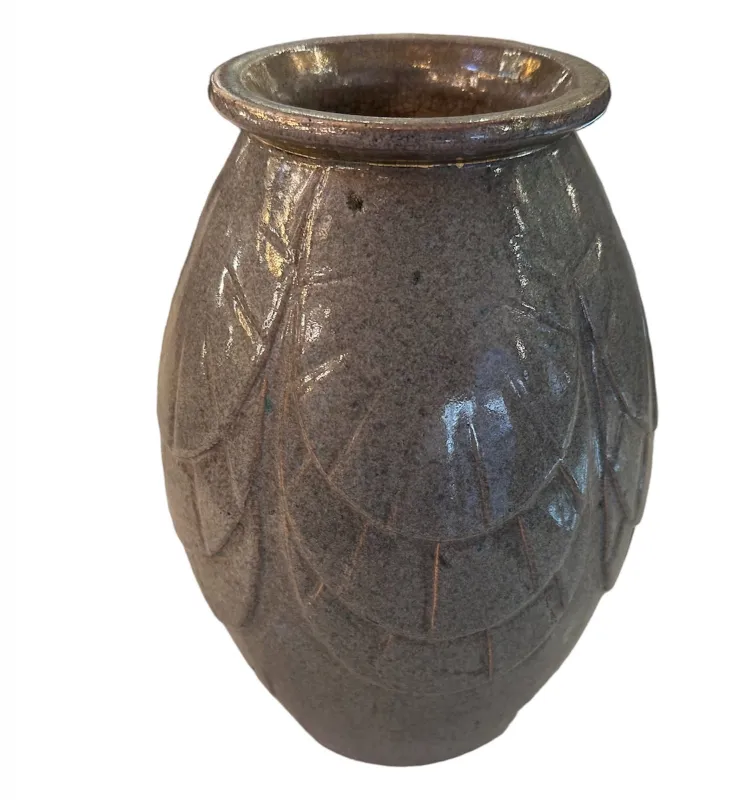 Antique ceramic vase with reliefs, light gray color, ornamental style.