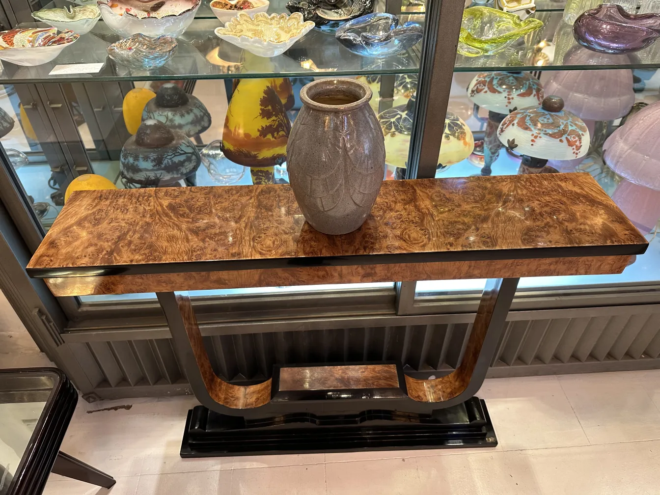 Ceramic vase on decorative wooden console, antique display