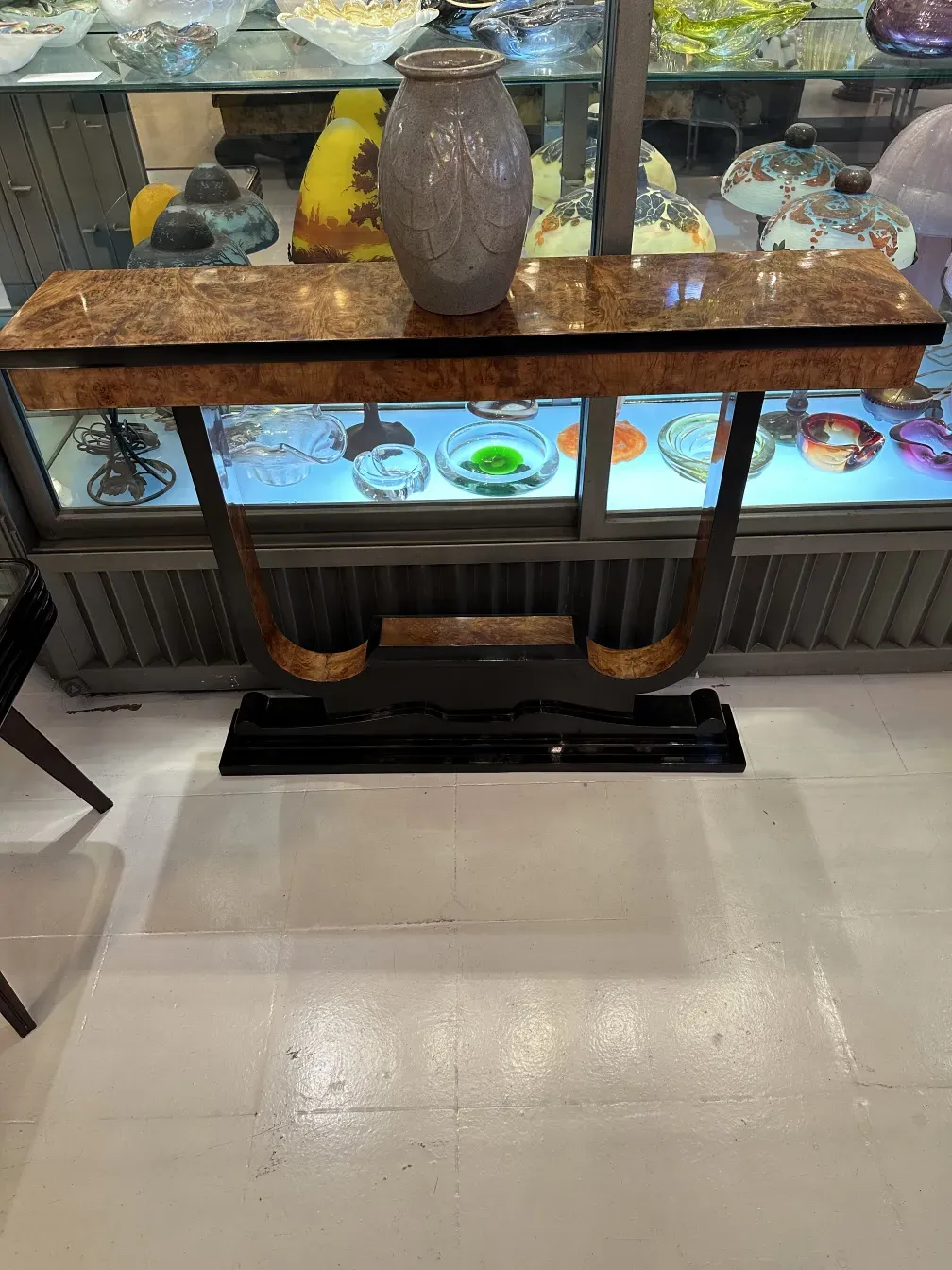 Antique ceramic vase on an elegant console table.