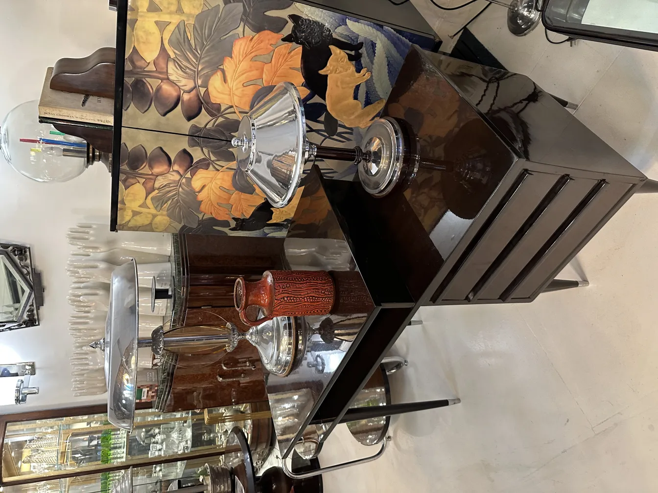 Antique decorative ceramic with intricate designs and warm colors, set in a vintage environment.