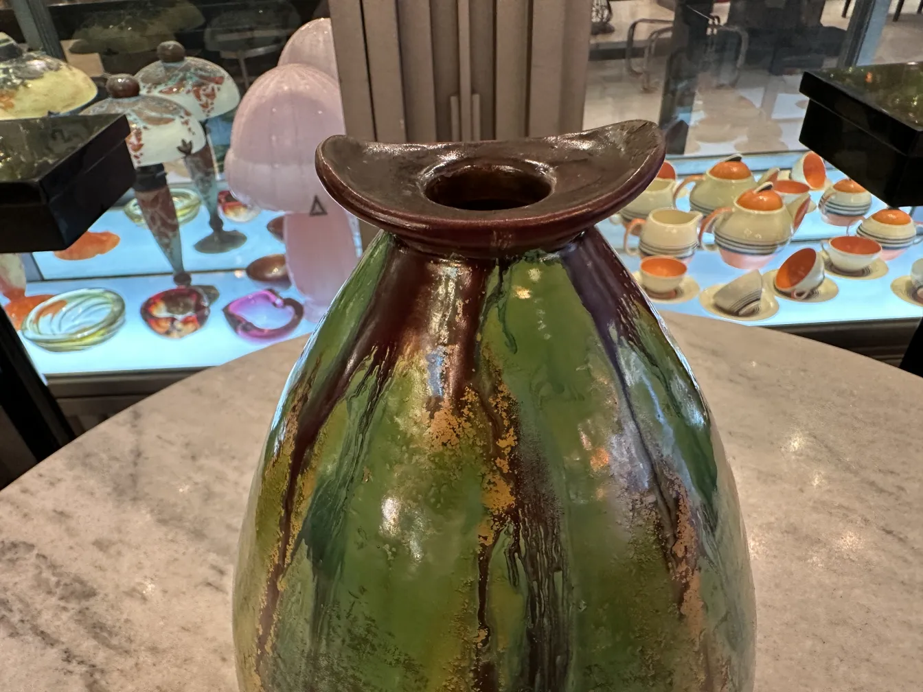 Antique ceramic vase with vibrant colors and shine