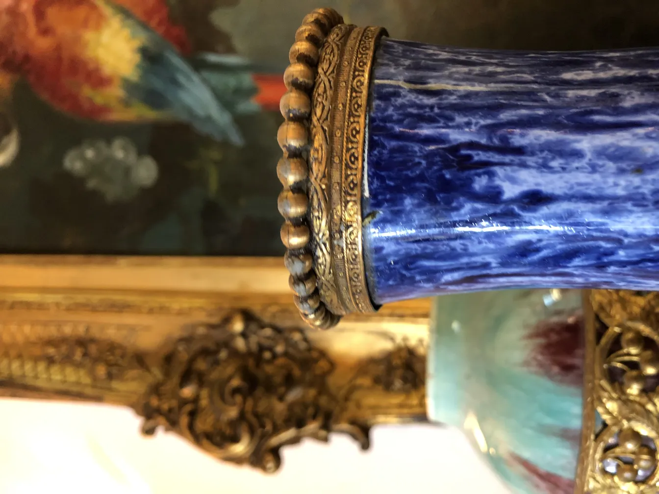 Antique decorative blue ceramic vessel with golden detail