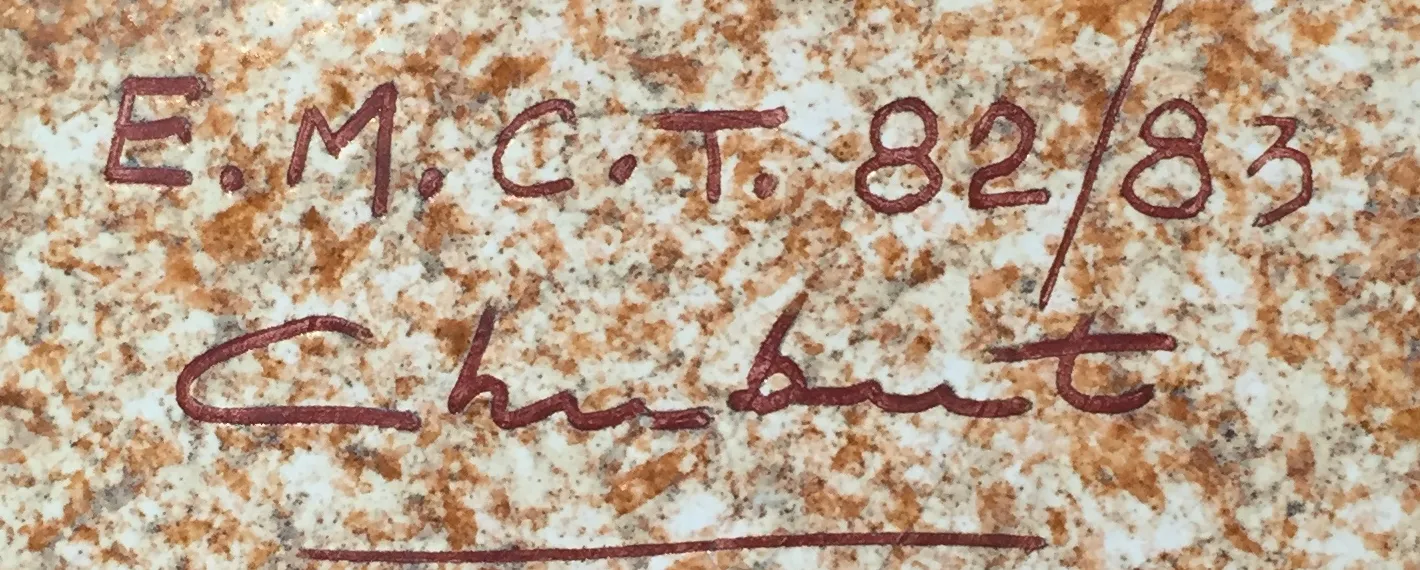 Antique ceramic with visible signature and distinctive texture.