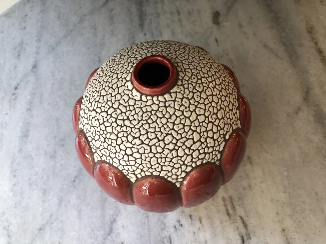 antique ceramic vase with textured design in white and red, by St. Clement