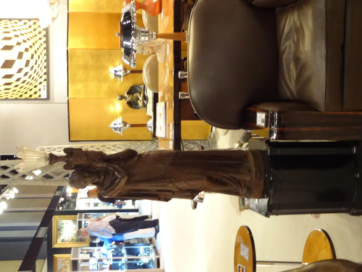 carved antique figure of val d´osne in an elegant setting