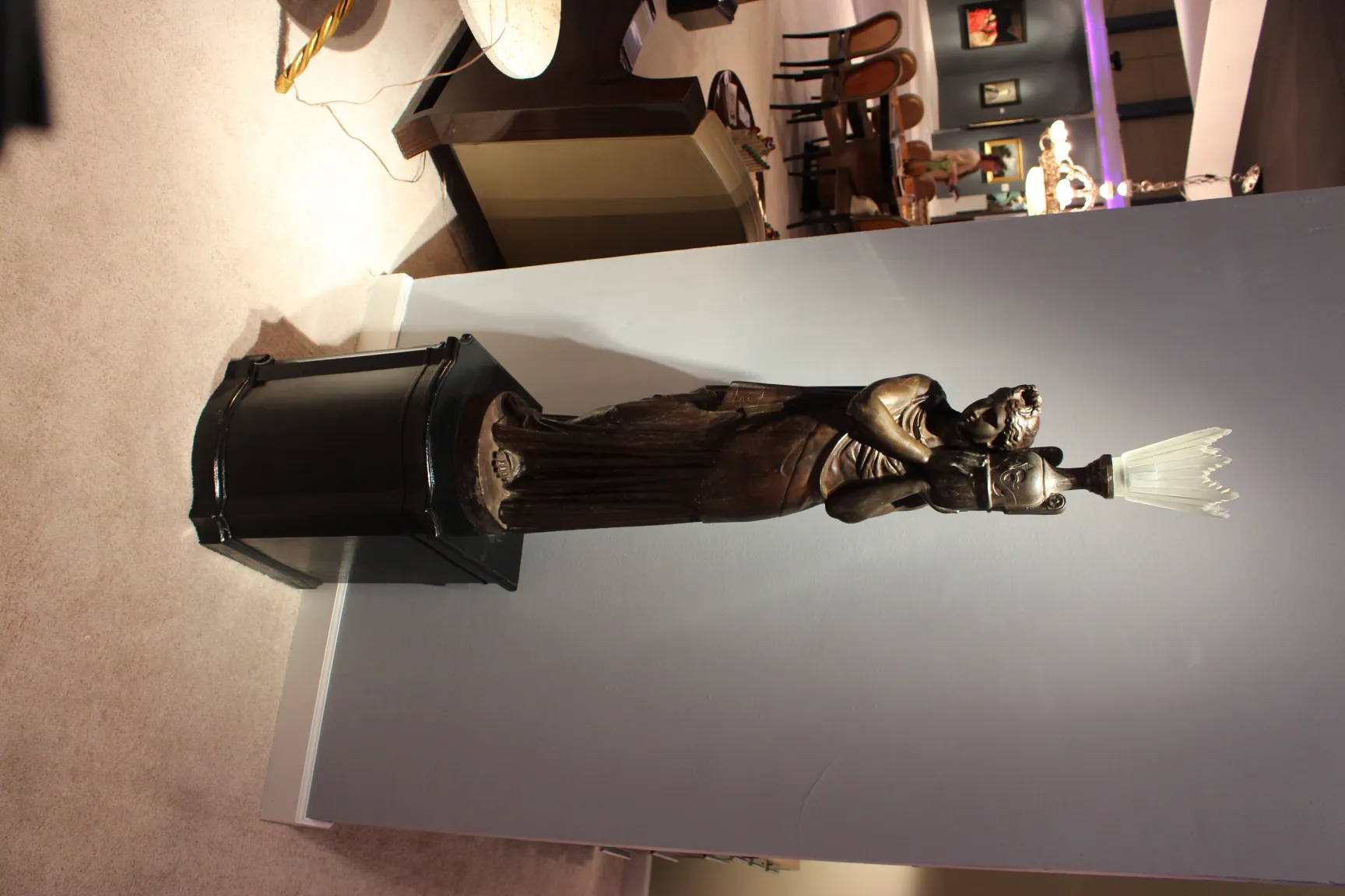 antique sculpture val d´osne with female figure in an elegant setting