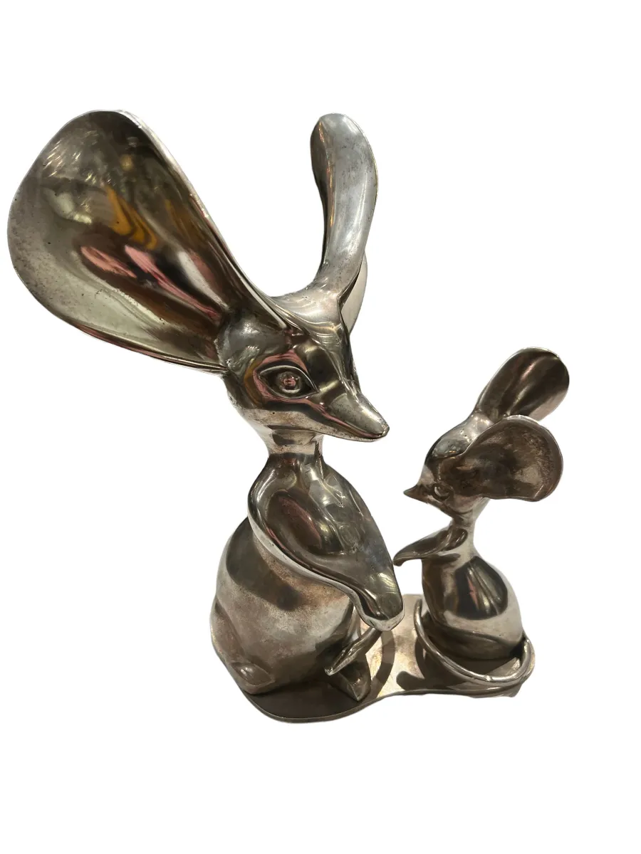 Antique sculpture of two rodents with unique features.