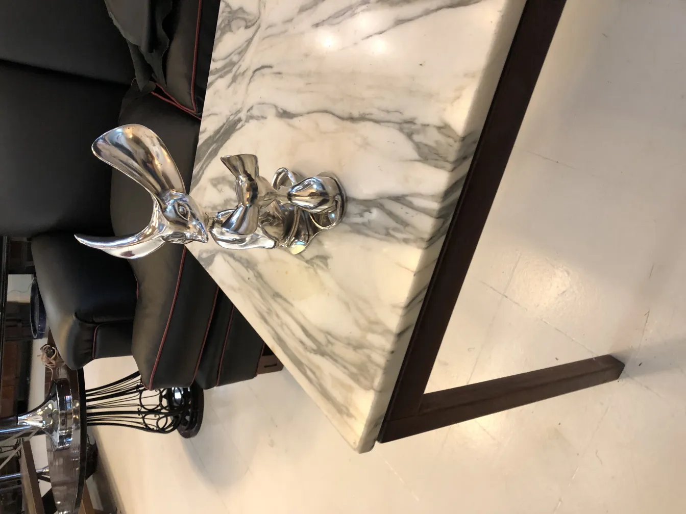 Antique decorative sculpture with elegant details on marble table