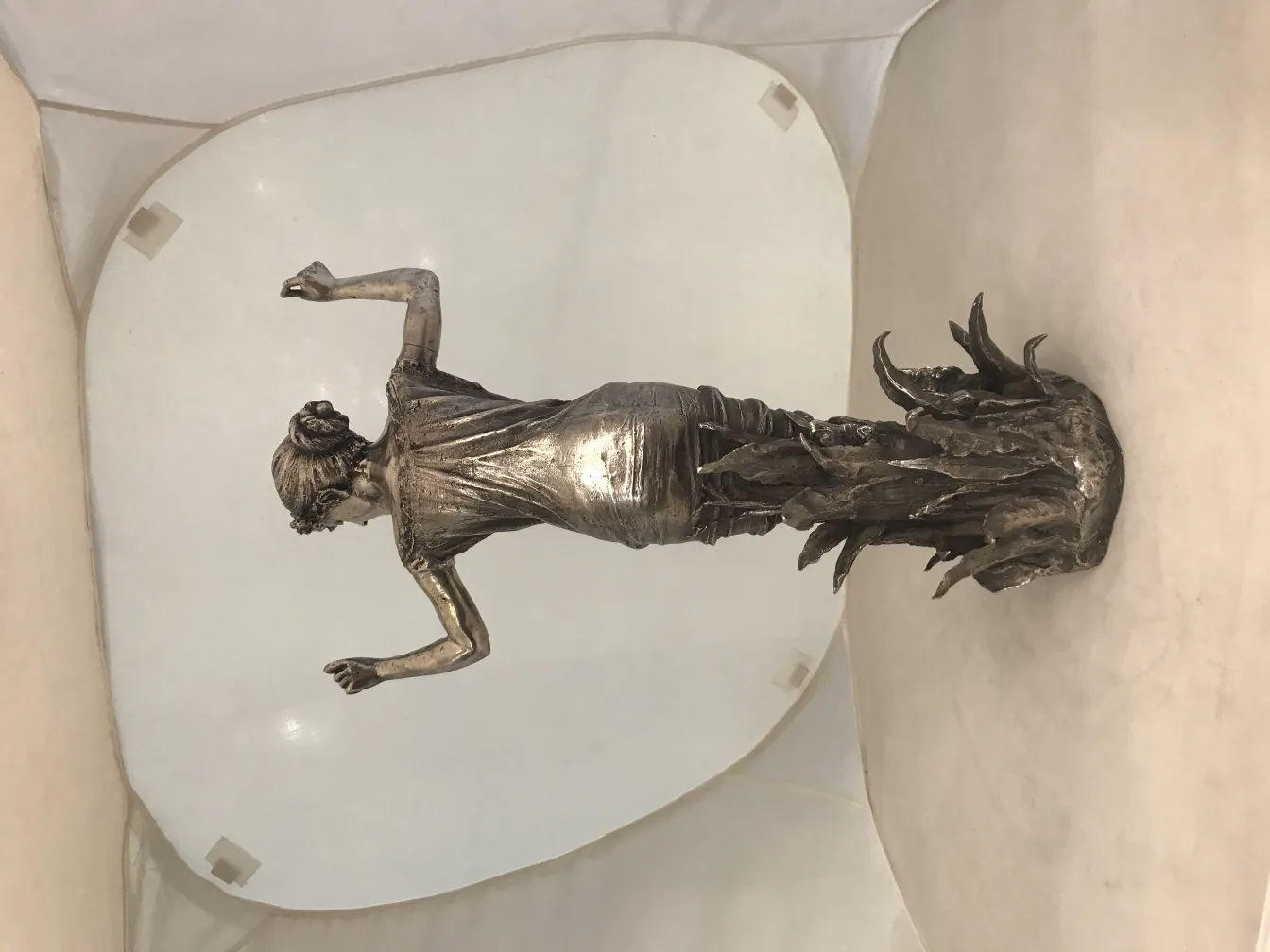 antique sculpture of female figure with refined details