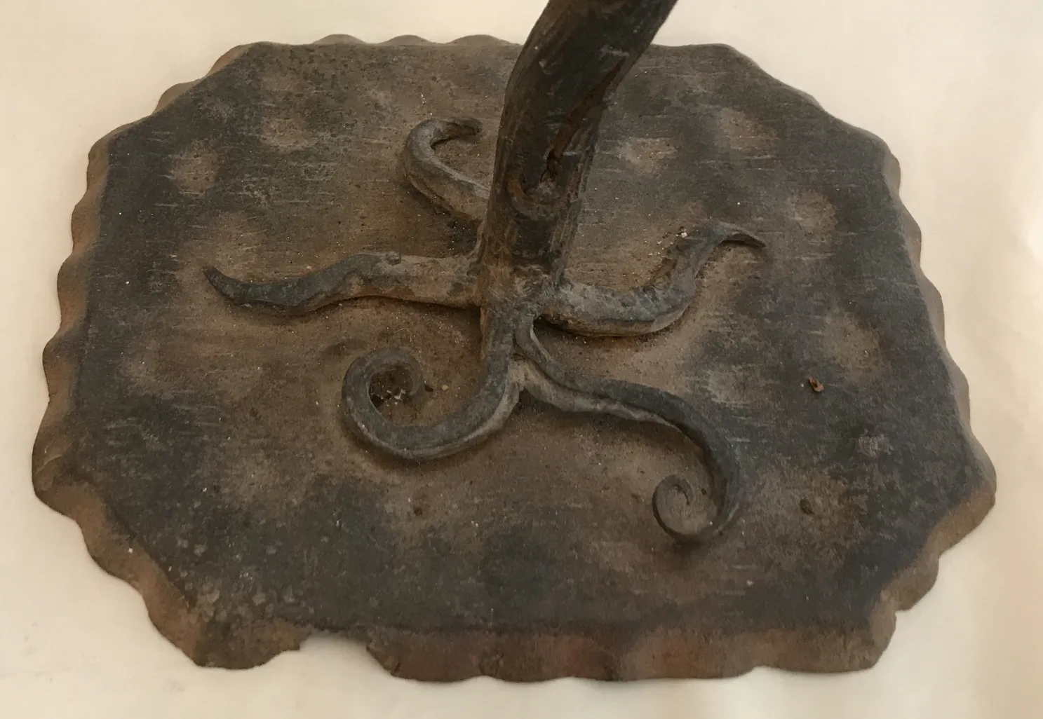 Base of ancient sculpture with decorative details