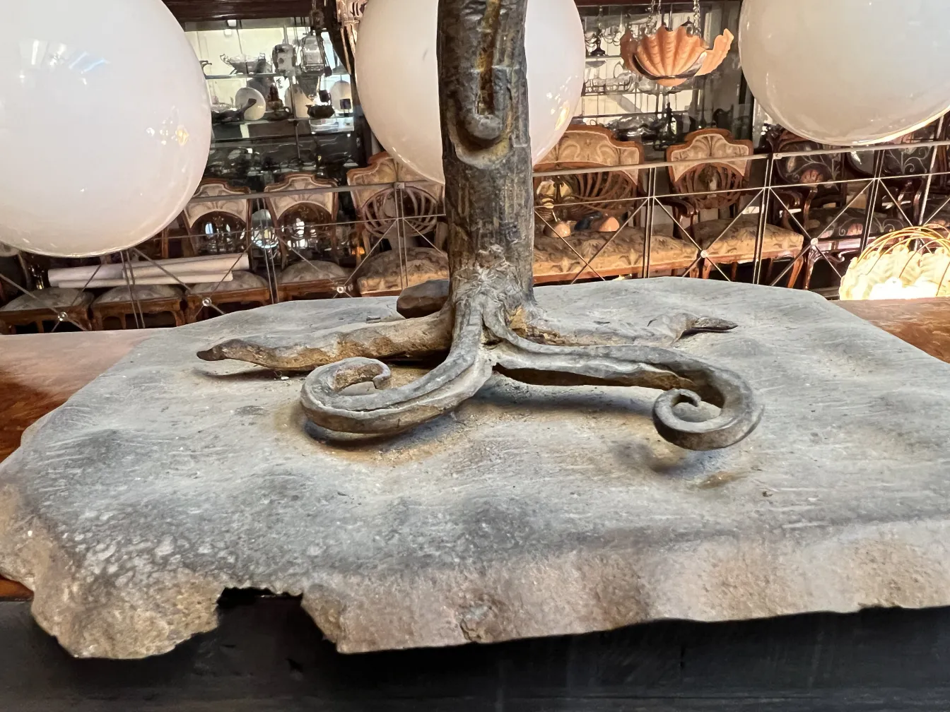 sculpture with elegant base and decorative details, antique setting