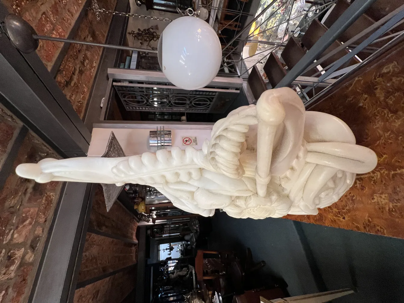 Stunning antique sculpture with unique shapes in eclectic decor.