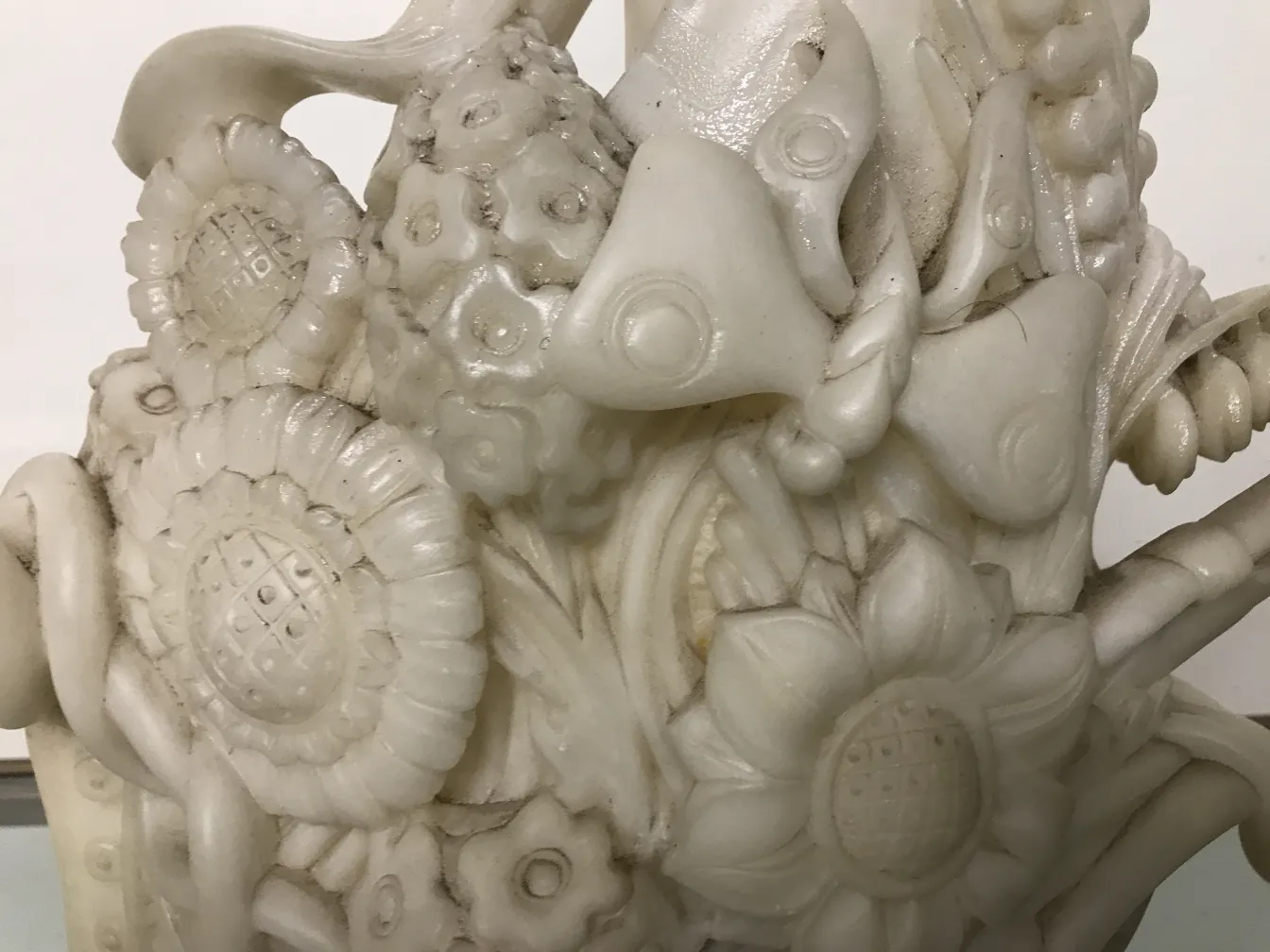 antique sculpture featuring delicate floral details and clear texture