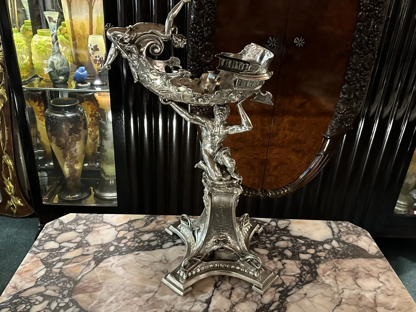 Decorative antiques sculpture featuring a male figure