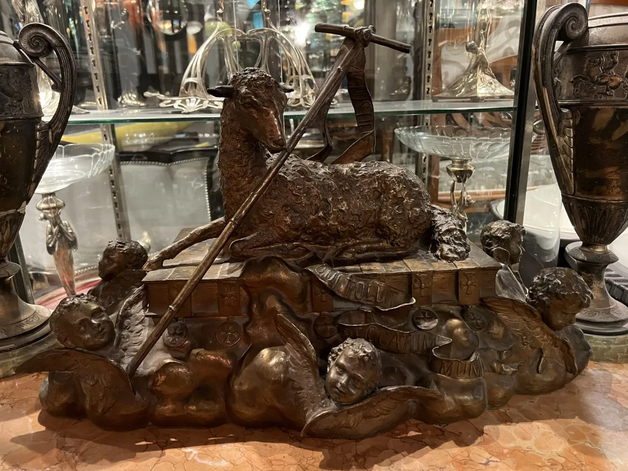 antique sheep sculpture on base with angels, decorative