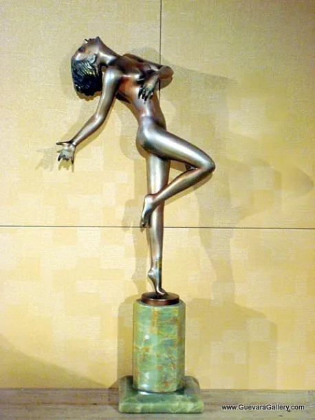 antique sculpture of a female figure in an elegant pose on base