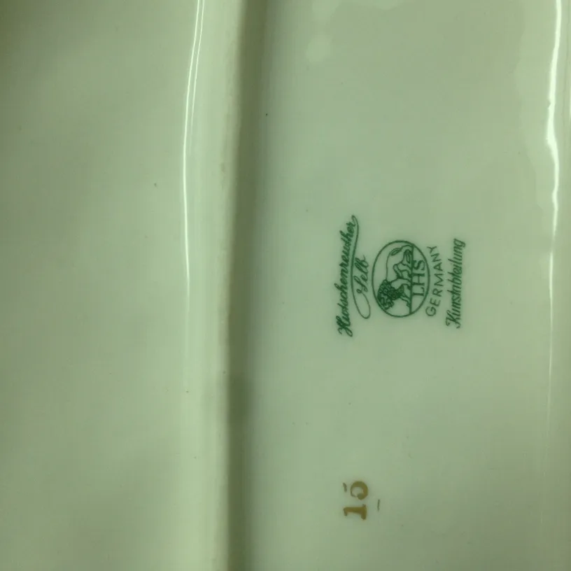 detail of ancient ceramic with green and gold mark