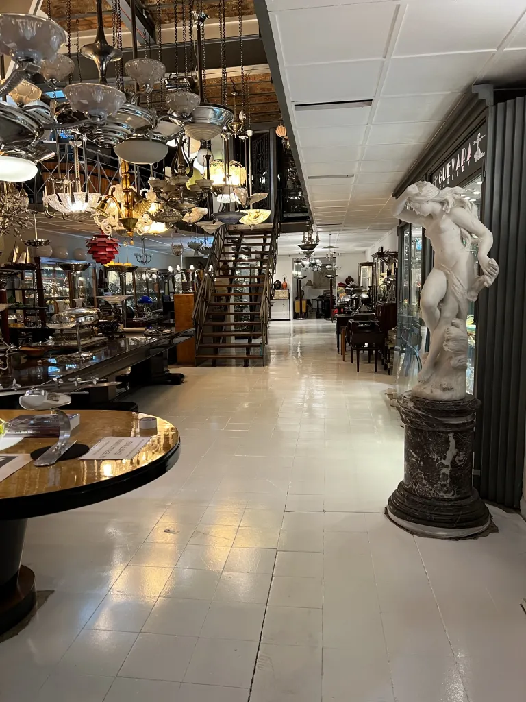 Antique sculpture of a male figure in an antique shop.