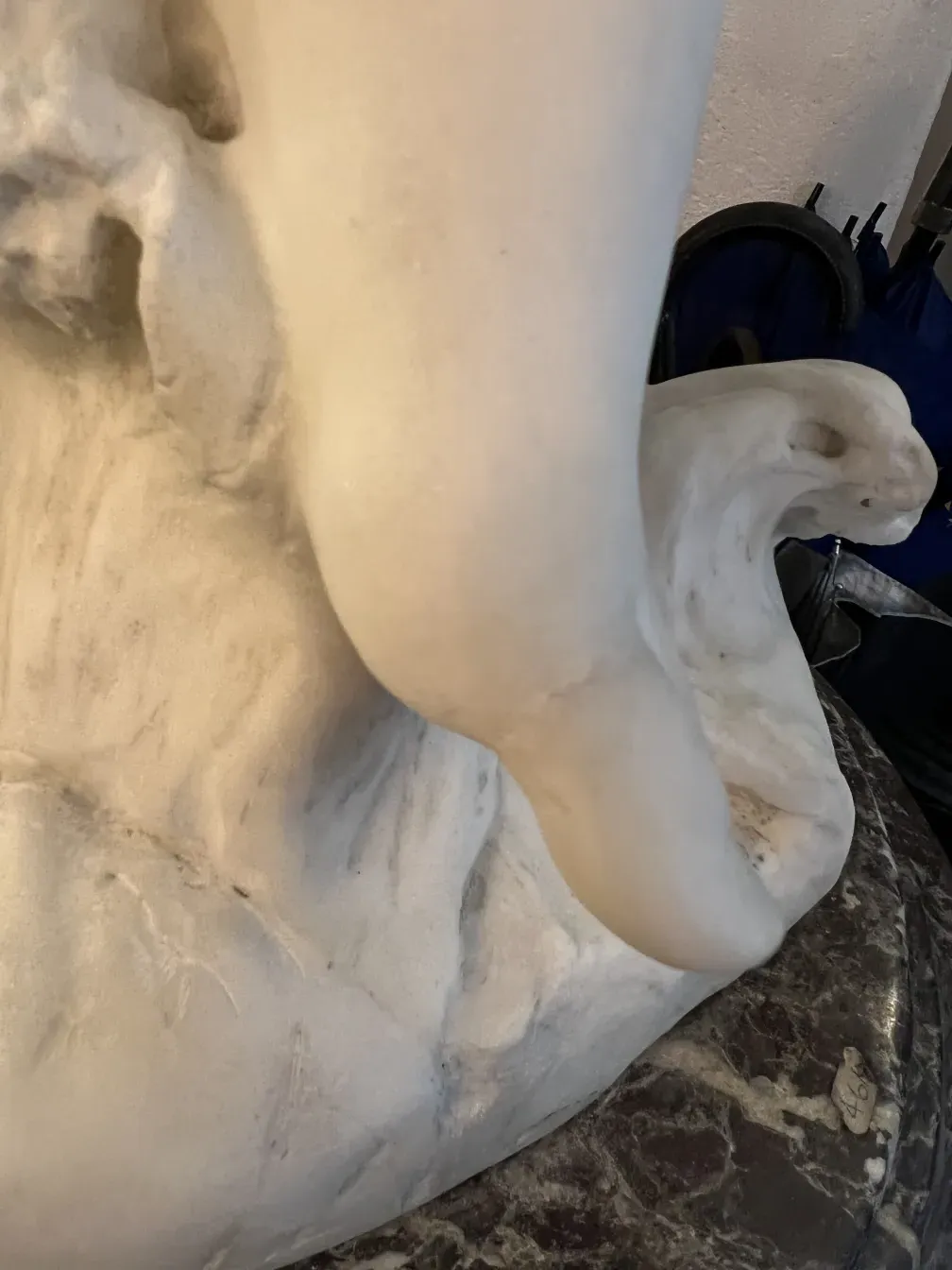 detail of antique sculpture with soft shapes and neutral setting