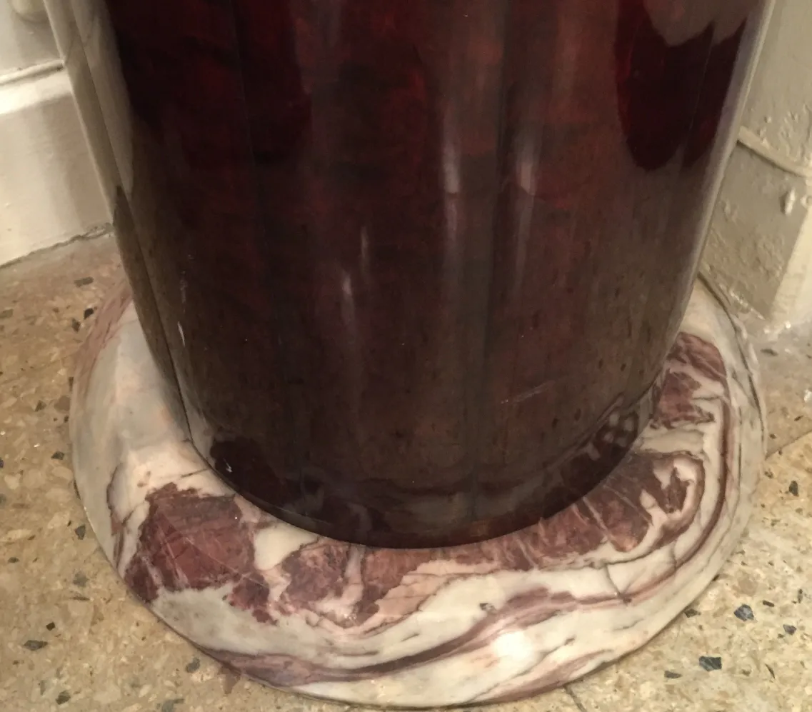 Antique decorative column in interior space, round base