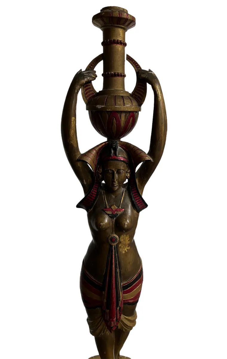 ancient sculpture of woman holding a decorative vase