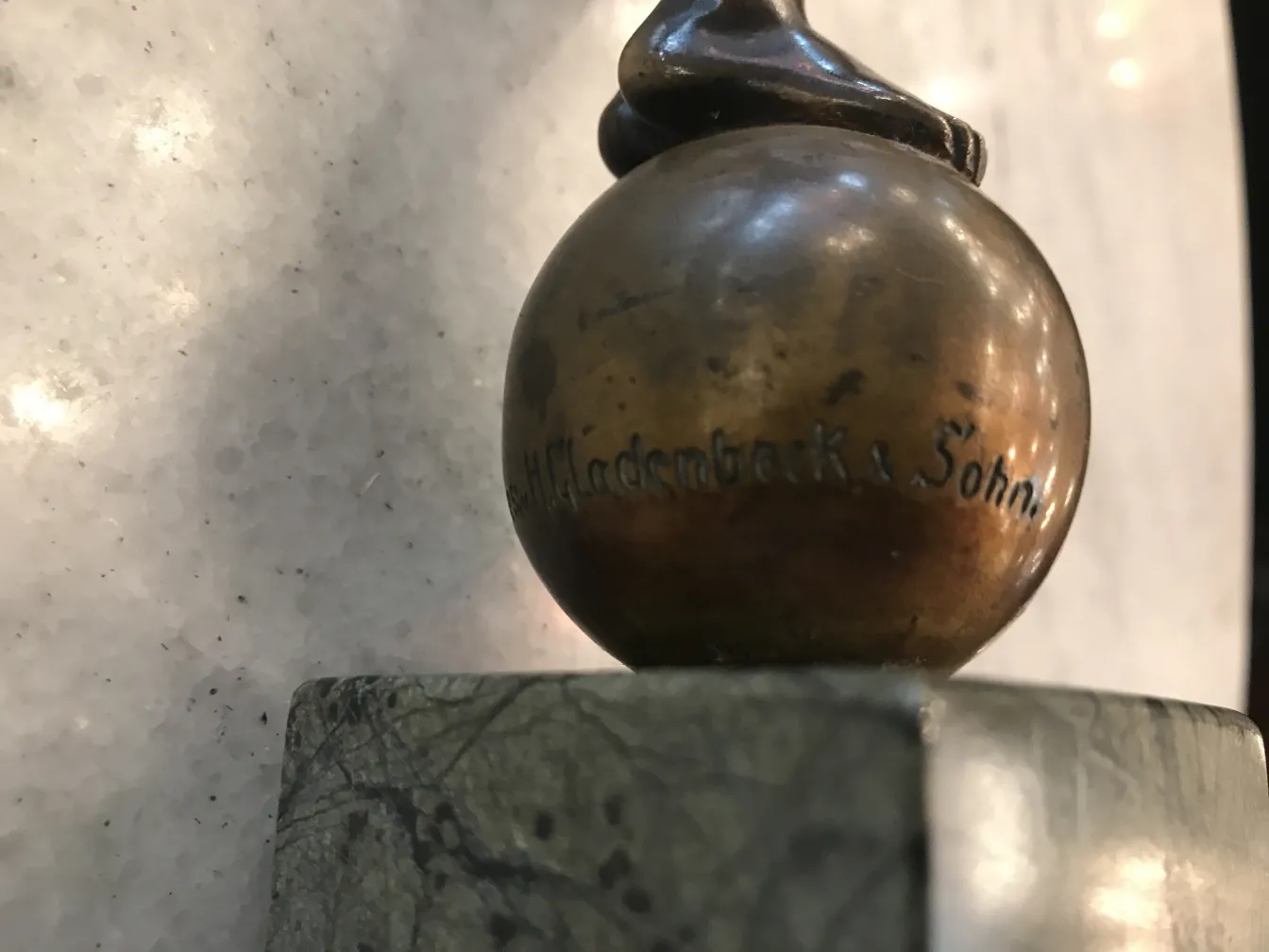 Antique round sculpture with decorative details