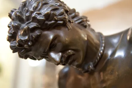 close-up of antique sculpture with intense facial expression