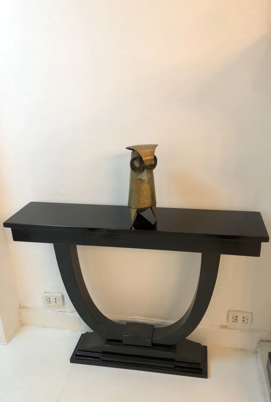 antique owl sculpture on black table