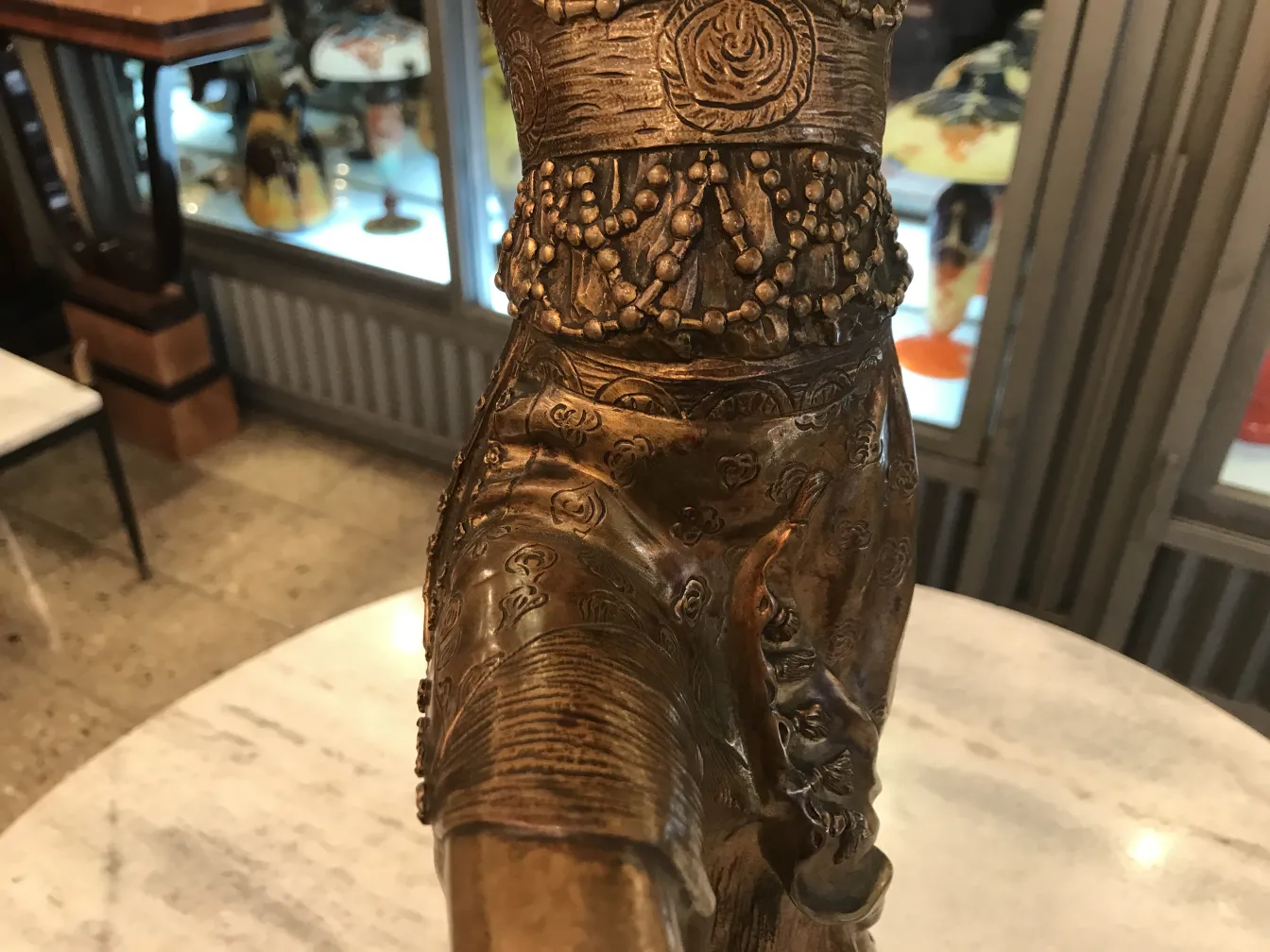 antique sculpture with elaborate details and a nostalgic background