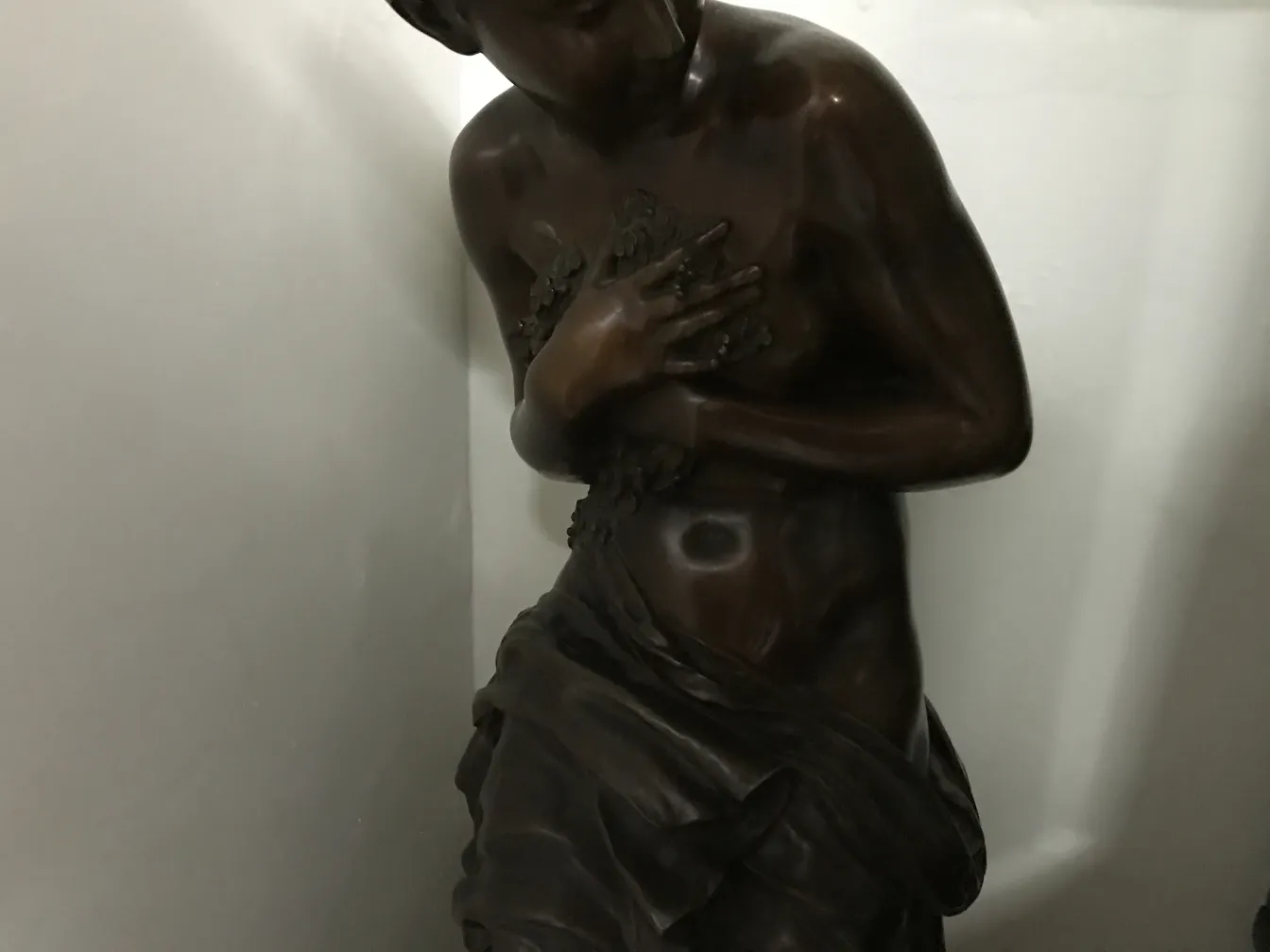 antique sculpture of a man with decorative details
