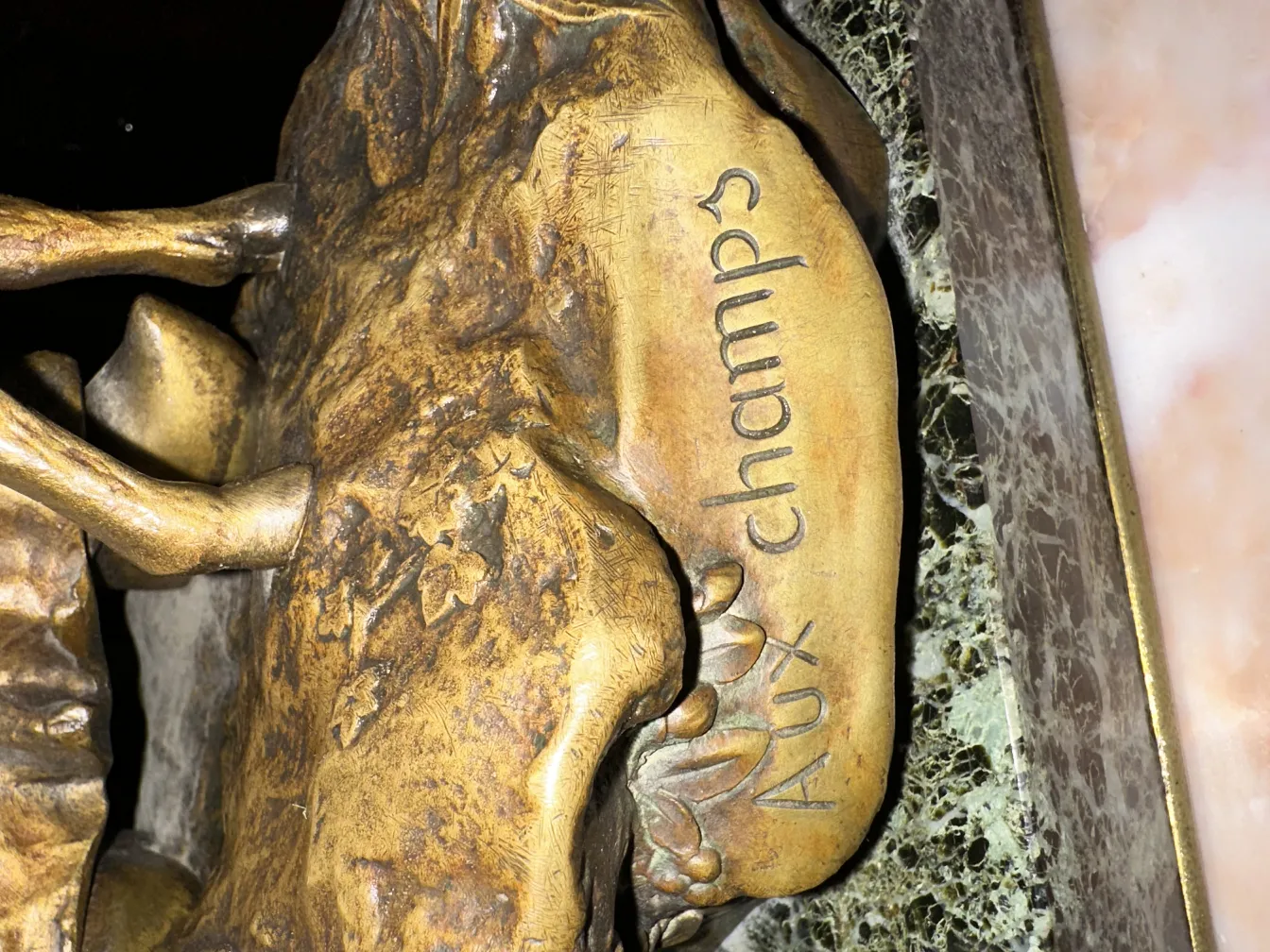 ancient sculpture with carved details, signed Aux Champs.