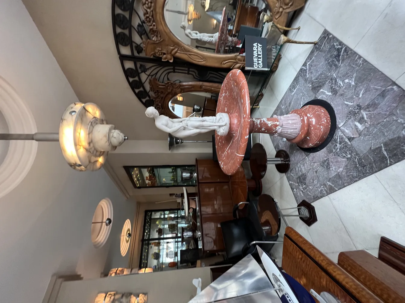 antique pink marble sculpture in elegant room