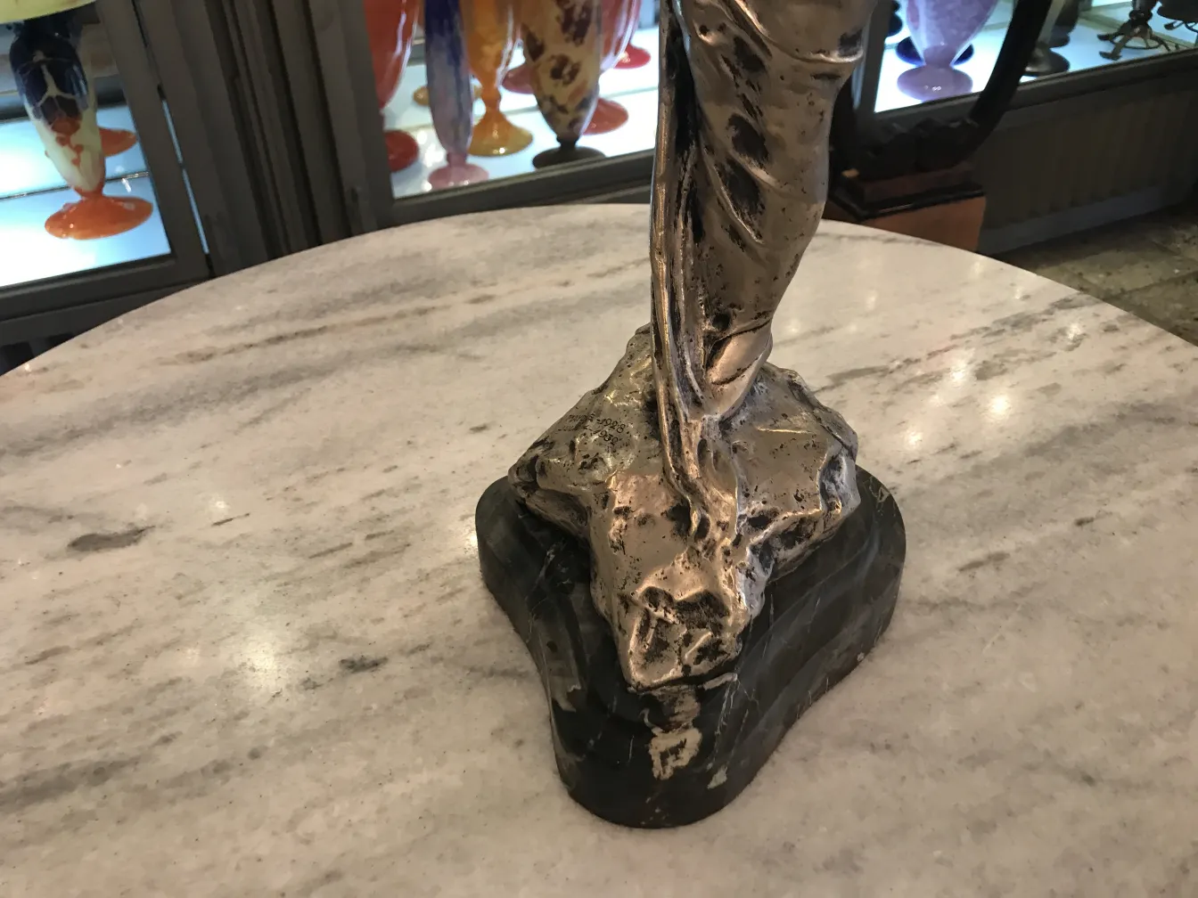 antique sculpture with details on the figure