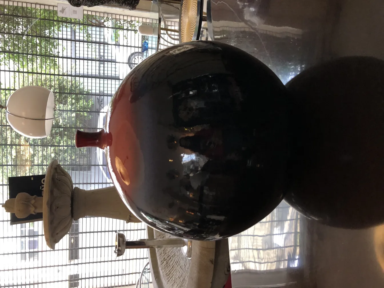 Ancient ceramic sphere with a shiny finish in an appealing setting