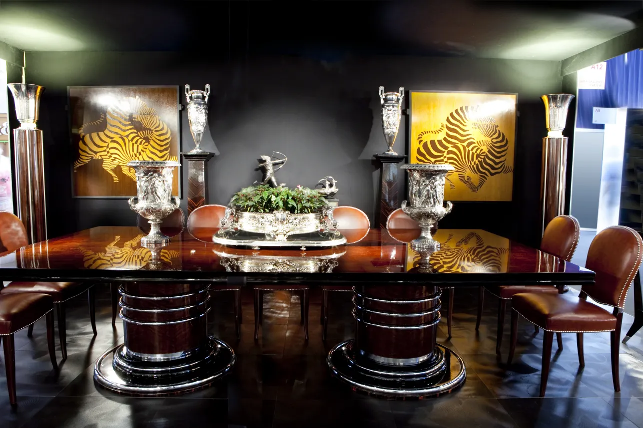 antique sculpture featured on an elegant table with plants