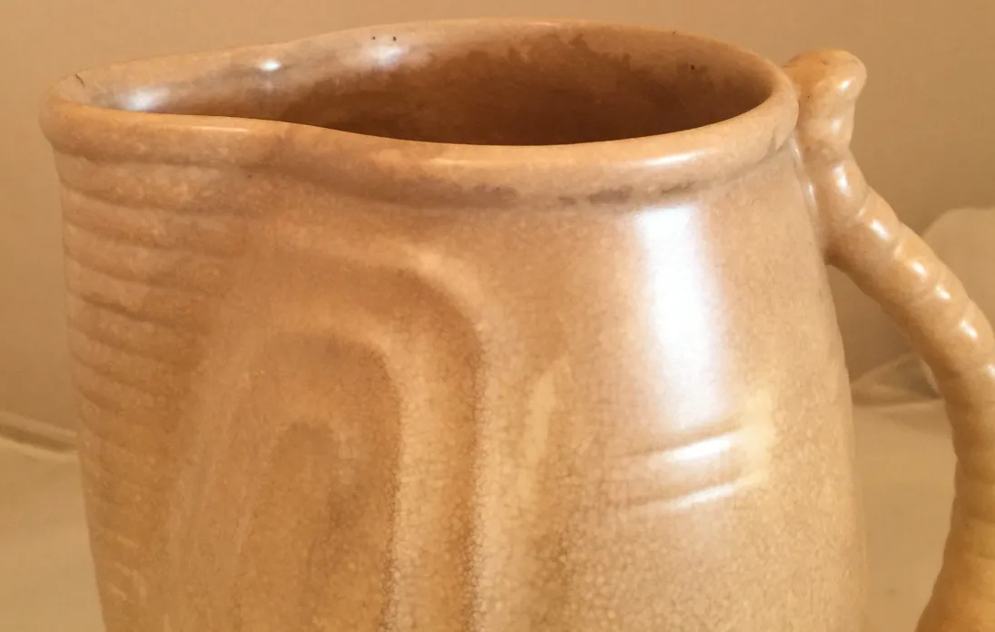 Antique ceramic jug with textured finish