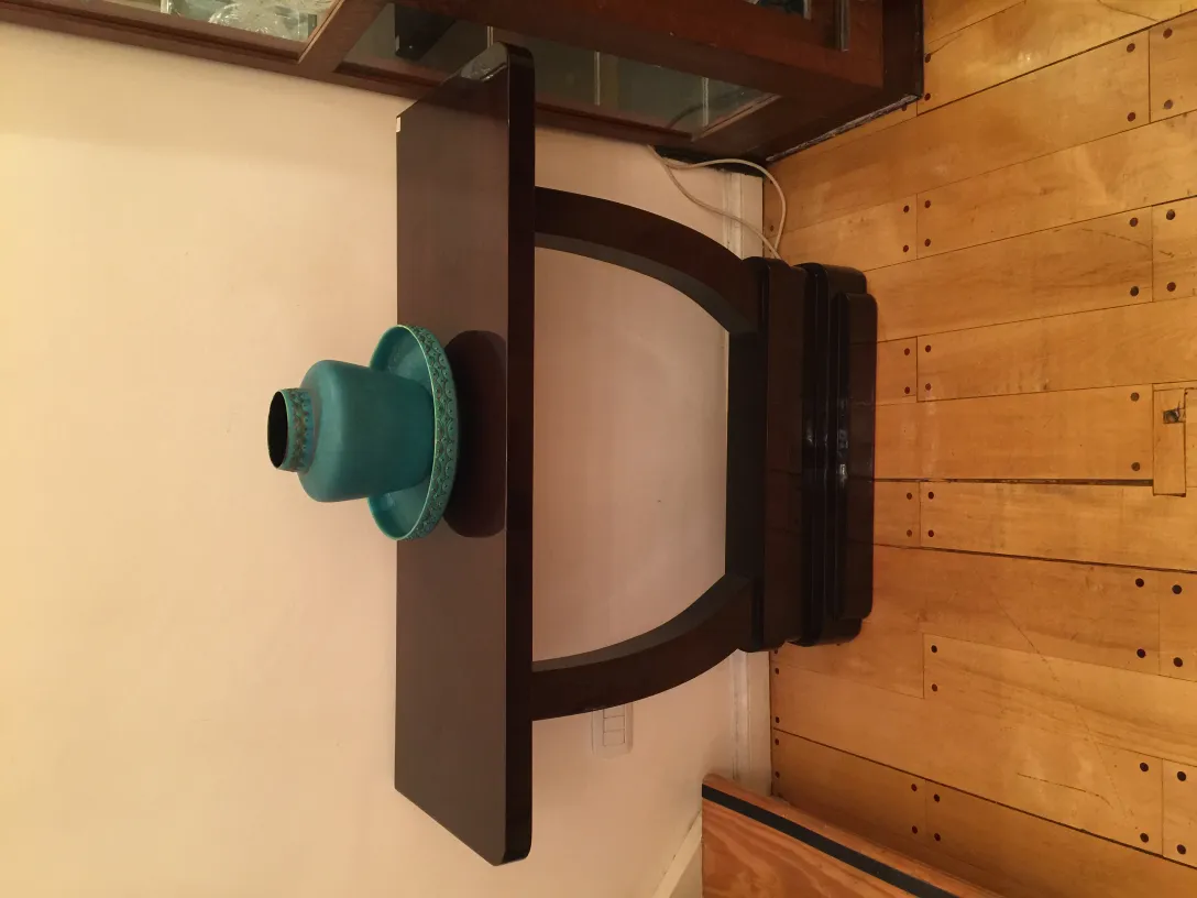 antique blue ceramic vase on wooden table