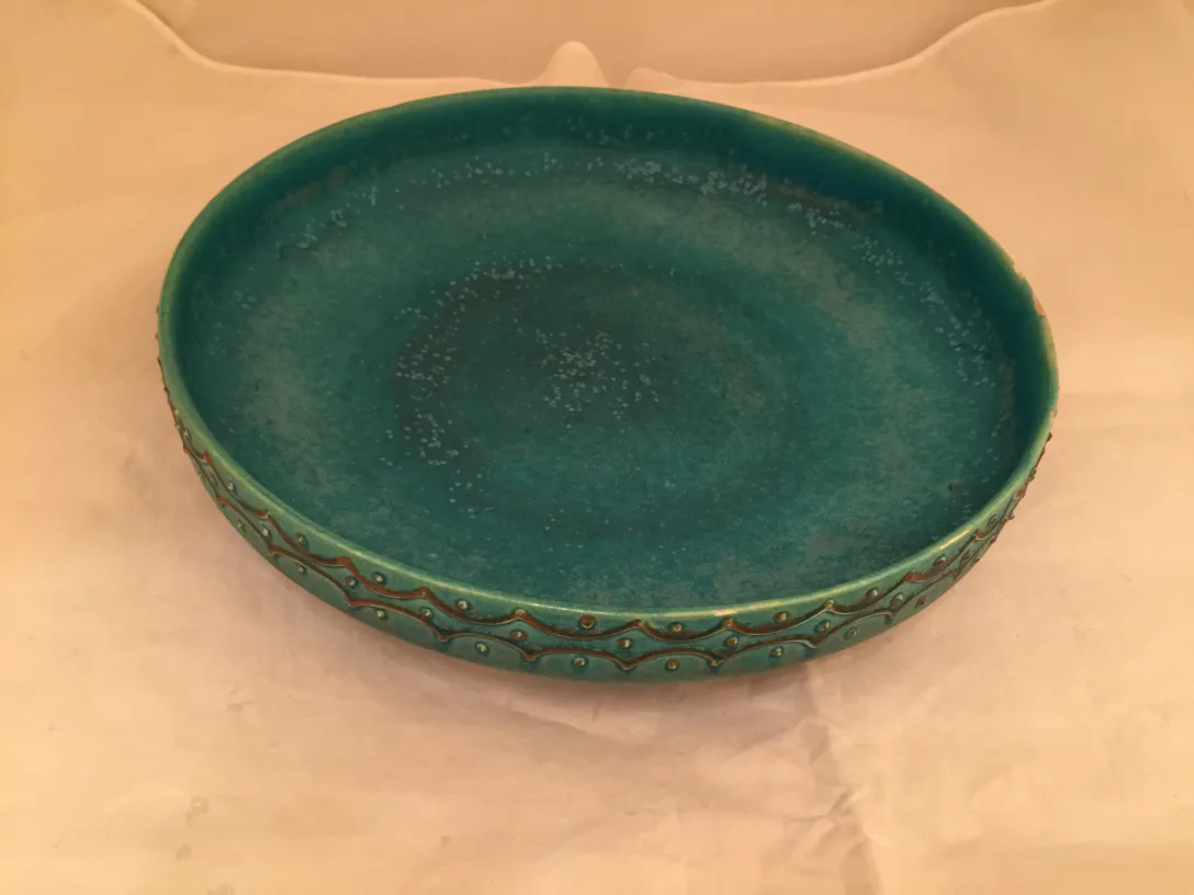 beautiful antique green ceramic plate with detailed design