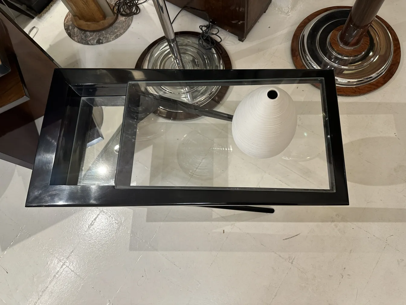 white antique ceramic vase on glass table